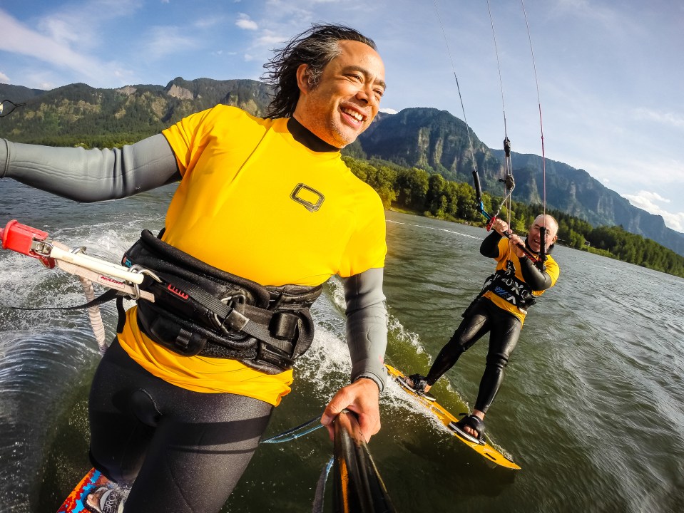 the instructor giving the student some on the water coaching to help refine skills