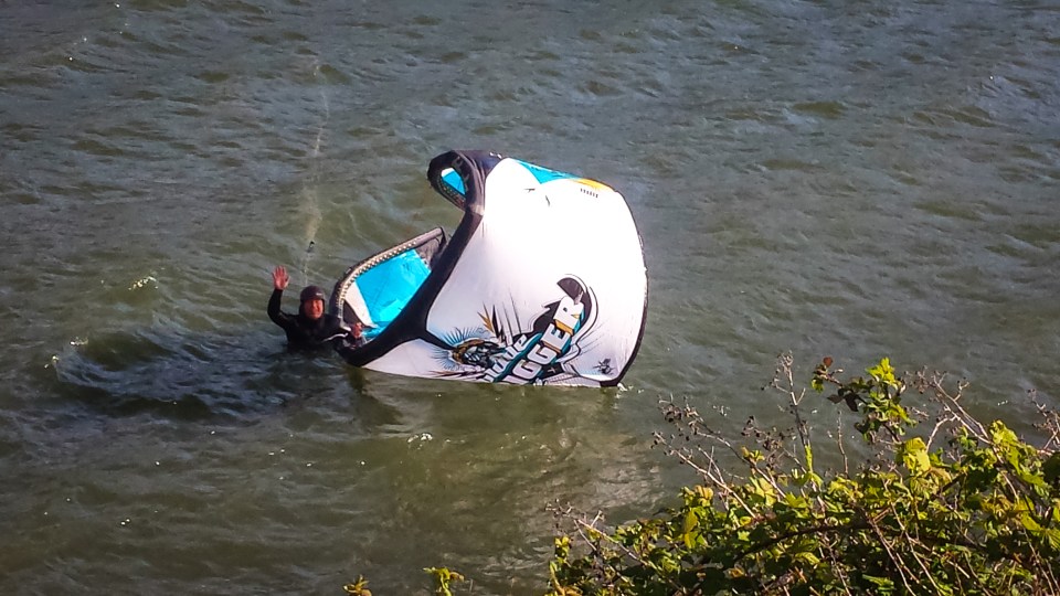 the instructor demonstrating the proper technique for self rescuing with a kite